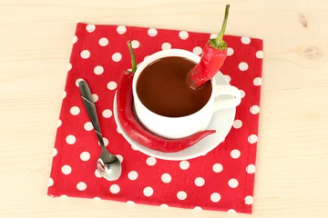 Foto op Plexiglas white cup with hot chocolate and chili pepper © Africa Studio