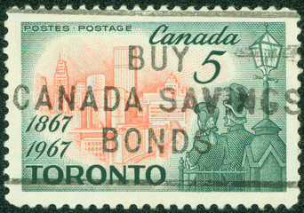 stamp shows Toronto in 1967 and Citizens of 1867