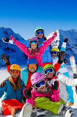 Skiing, winter fun - happy skiers, family ski team