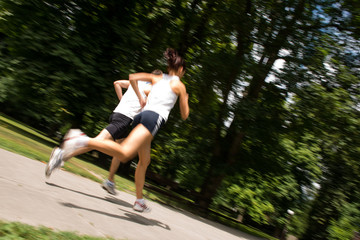 Young couple jogging - motion blurr