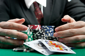 Naklejka premium businessman, won all jackpots and takes all the chips
