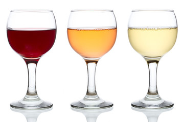 Three glasses of red, rose and white wine isolated on white