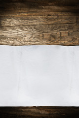 Old empty paper roll on wood