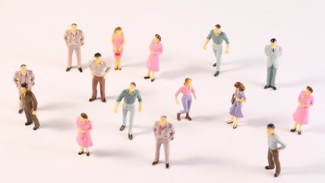 Miniatures of men and women appear on screen