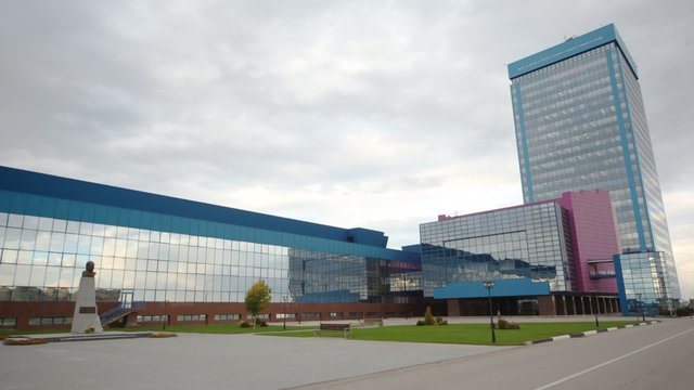 Office building of manufacturer plant stands against the sky