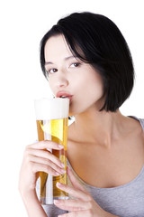 Beautiful and sexy young woman drinking beer
