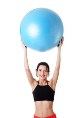 Young healthy lifestyle woman with pilates exercise ball.