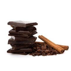Chocolate bars stack and cinnamon sticks
