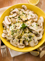 salad with champignon grated lemon peel garlic and parsley