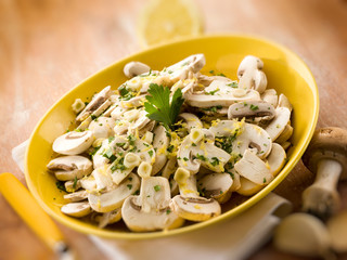 salad with champignon and grated lemon peel, selective focus