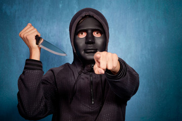 man with mask and knife