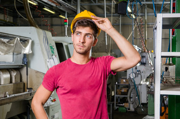 Worker, while touching the helmet.
