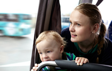 Mother and son travel by bus.