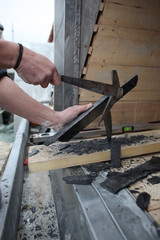 Man preparing slate for roof