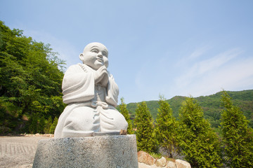 young monk statue