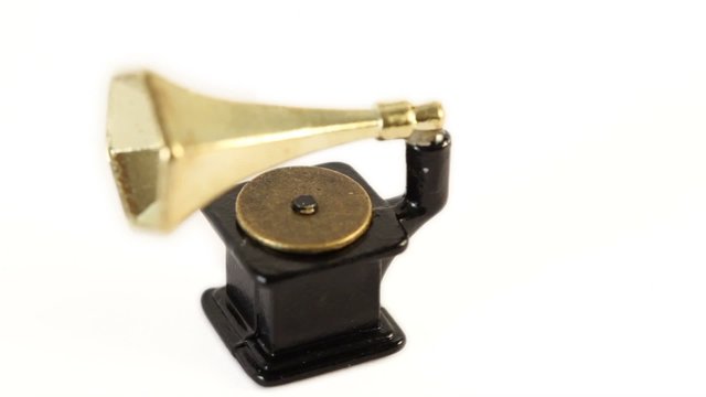 Toy vintage gramophone circling isolated