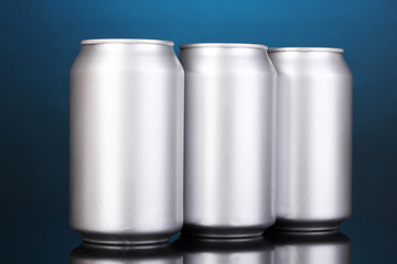 aluminum cans on blue background