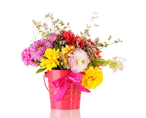 Bright pink bucket with flowers isolated on white
