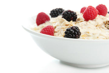 tasty oatmeal with berries, isolated on white