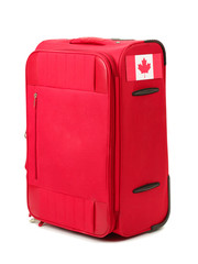 red suitcase with sticker with flag of Canada isolated on white