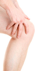 man holding sore knee, isolated on white