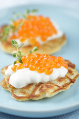 Blinis with red caviar