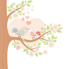 Two kissing birds on the tree