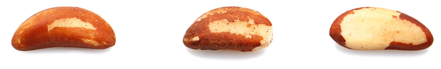 Three individual brazil nuts sperated over white.