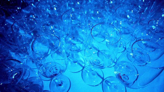 Many glasses in lit by blue light