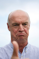 Bald man giving the thumbs-up