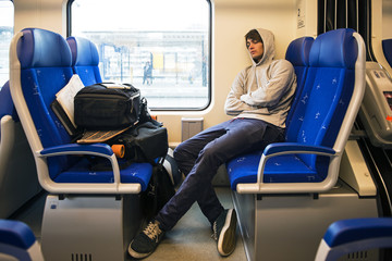 Young Man Sleeping In Train