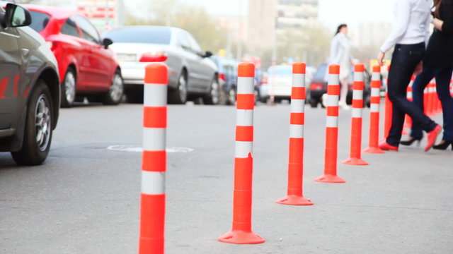 protective barrier made of columns, people and cars go road