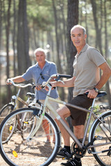Two middle-aged men on bike ride