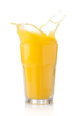 Fototapeta na wymiar splash of orange juice in a glass