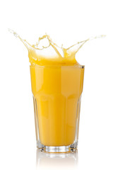 splash of orange juice in a glass
