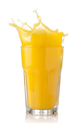 Obraz na płótnie Canvas splash of orange juice in a glass