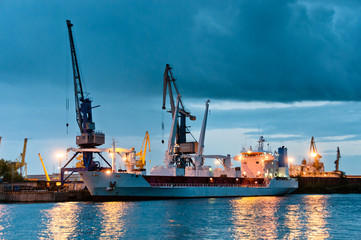 Shipyard with ship at dusk time