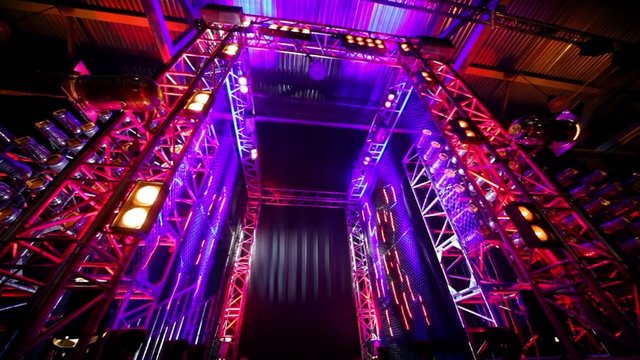 Gate of metal constructions with colorful illumination