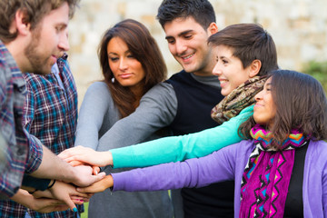 Multiracial Students with Hands on Stack