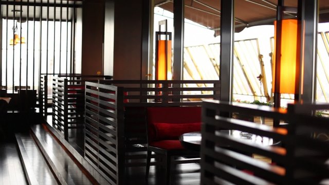 Table stands separated by baffles in restaurant lounge