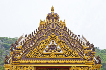 Fototapeta na wymiar Detail of ornately decorated temple roof