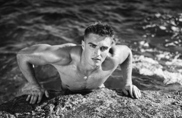 young attractive man staying in the sea
