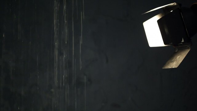Waterfall in dark room with spotlight