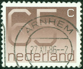 stamp printed in the Netherlands shows numeral ordinary gum