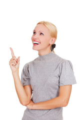 Smiling woman pointing at something interesting