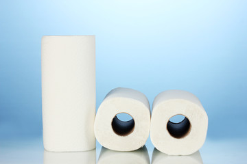 rolls of toilet paper on blue background