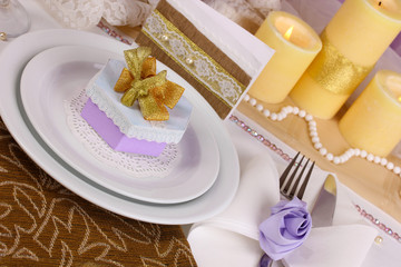 Serving fabulous wedding table in purple and gold color
