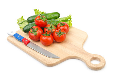 Tomatoes and cucumbers on white