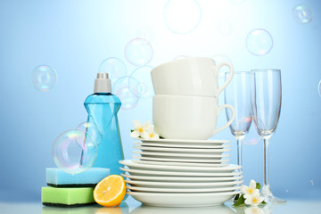 empty clean plates, glasses and cups with dishwashing liquid,