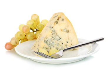 Cheese with mold and grapes on the plate isolated on white